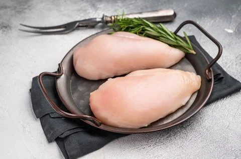 Raw poultry fillets, ready to be seasoned and cooked. These versatile cuts .. Stock Photos