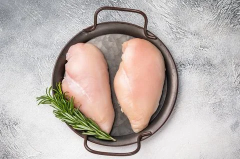 Raw poultry fillets, ready to be seasoned and cooked. These versatile cuts .. Stock Photos