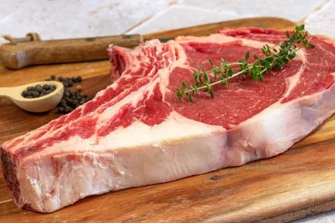 Raw prime rib, close-up, on a cutting board 스톡 사진