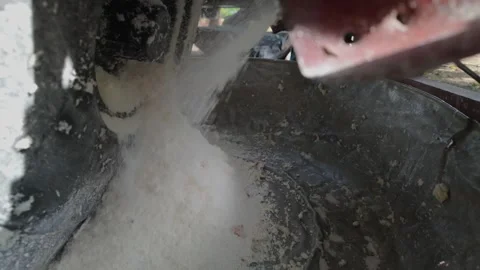 Raw process of making flour from manioc root using a simple wooden grater Stock Footage 316372754