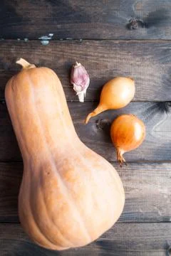 Raw pumpkin, onions and garlic clove Stock Photos