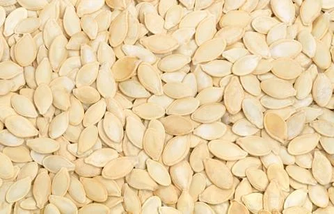 Raw pumpkin seeds background Stock Photos