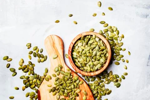 Raw pumpkin seeds, food background, top view Stock Photos