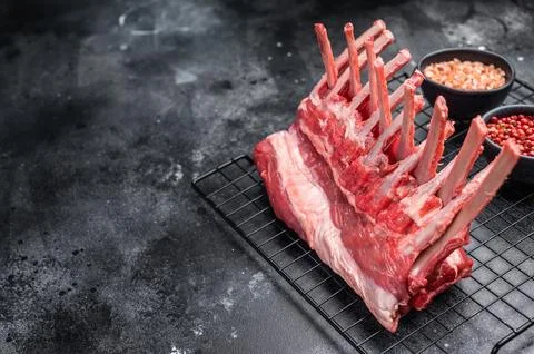 Raw rack of lamb, fresh mutton meat for chops cutlets. black background. to.. Stock Photos
