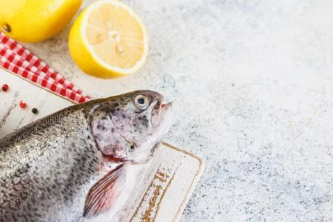 Raw rainbow trout light background Stock Photos