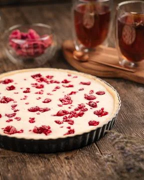 Raw raspberry pie on the wooden table Stock Photos