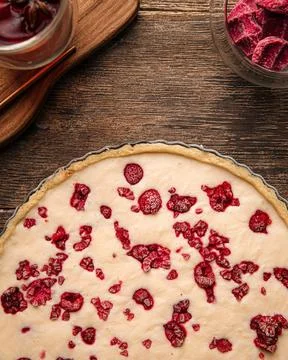 Raw raspberry pie on the wooden table Stock Photos