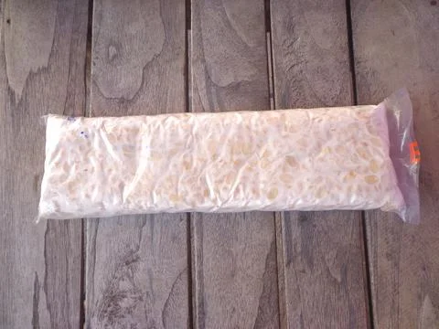 Raw rectangular tempeh that is still in its packaging Stock Photos