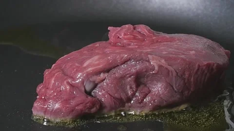 Raw Red Meat in Pan Slow Motion Stock Footage 169612321
