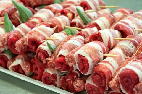 Raw red meat rolls Stock Photos