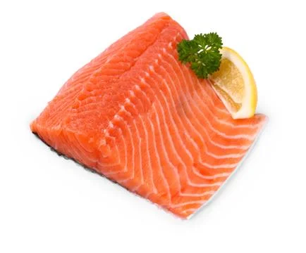 Raw, red salmon fillet with lemon wedge Stock Photos