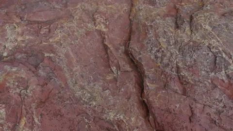 Raw red stone texture, rock close-up. 스톡 동영상 137055405