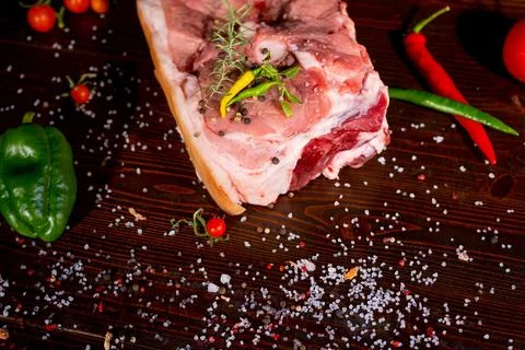 Raw rib eye beef steak on a black background Stock Photos
