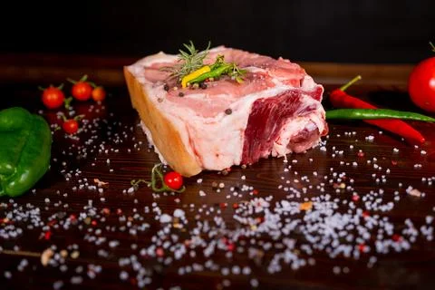 Raw rib eye beef steak on a black background Stock Photos