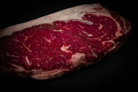 Raw ribeye beef steak. Texture of marble meat Stock Photos