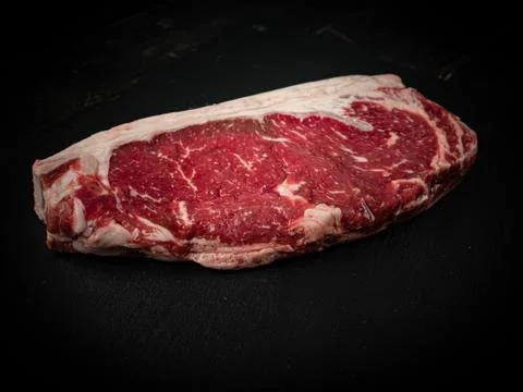 Raw ribeye beef steak. Texture of marble meat Stock Photos