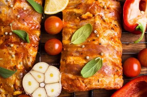 Raw ribs in marinade Stock Photos