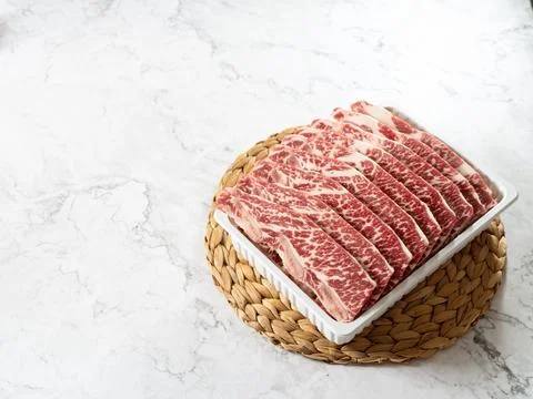 Raw ribs in packaging containers Stock Photos