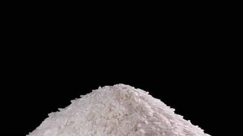 Raw rice grains rotating pattern. White basmati rice grains on black background Stock Footage 115845853
