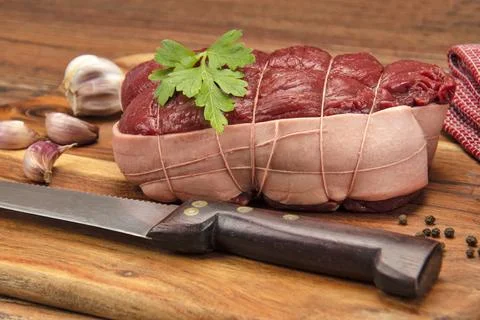 Raw roast beef on a table Foto stock