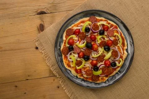 Raw rustic pizza Stock Photos