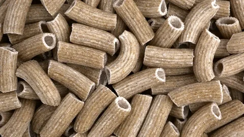 Raw rye rigatoni overhead shot rotating motion Stock Footage 87916543