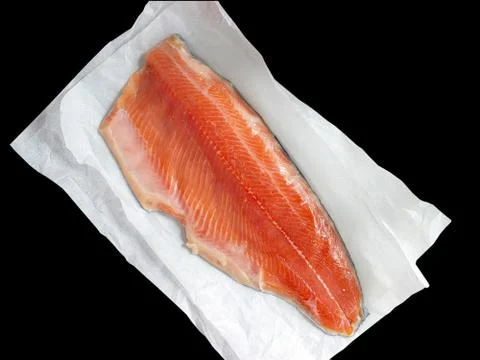 Raw salmon on a black background Stock Photos