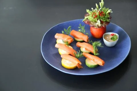 Raw salmon with cucumber Stock Photos