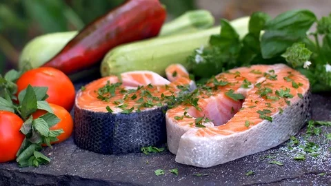 Raw salmon cutlet flavored with spices Stock Footage 121088565