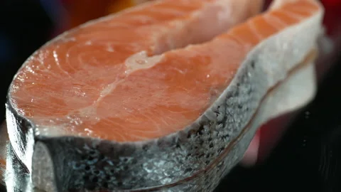 Raw salmon fillet with lemon falling slow motion 4k Stock Footage 131727932
