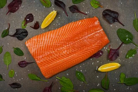 Raw salmon fish fillet on table Stock Photos