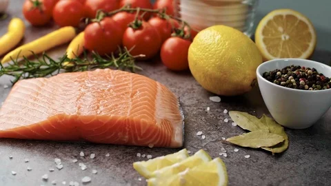 Raw salmon with fresh herbs Stock Footage 102883723