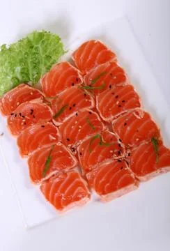 Raw salmon with lettuce leaf Stock Photos