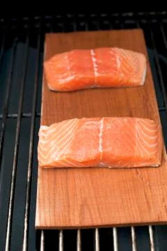 Raw Salmon on Plank Stock Photos