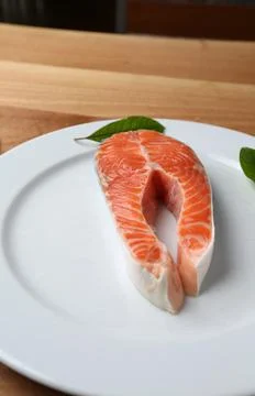 Raw salmon slice close up vertical photo Stock Photos