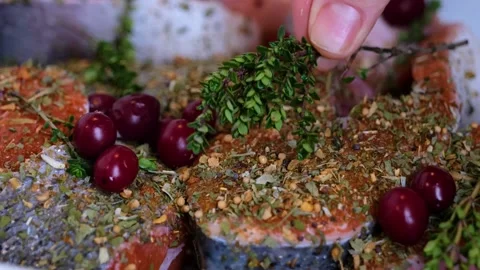 Raw salmon steak prepared with thyme Stock Footage 149667579