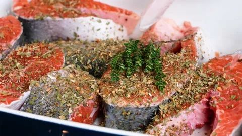 Raw salmon steak prepared with thyme Stock Footage 149667995