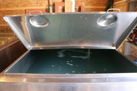 Raw sap collected from maple trees ready to be boiled Stock Photos