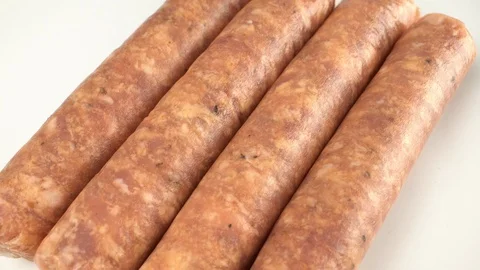 Raw sausages for grill Stock Footage 103632749