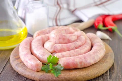 Raw sausages Stock Photos