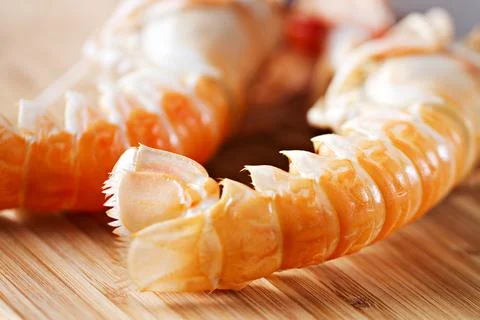 Raw scampi on cutting board . High quality photo. Stock Photos