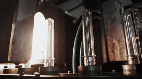The raw shape of a plastic water bottle on a conveyor belt. Stock Footage 288793104