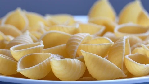 Raw shells rotating on a plate Stock Footage 102476649