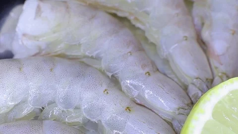 Raw shrimp with lemon and dil Stock Footage 82701283