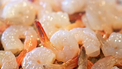 Raw Shrimp Seafood with Translucent Shells, Orange Tails, Natural Texture on Ice Video stock 347825340