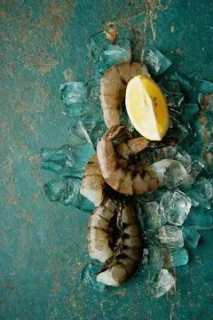 Raw shrimps on the dark rustic background Stock Photos