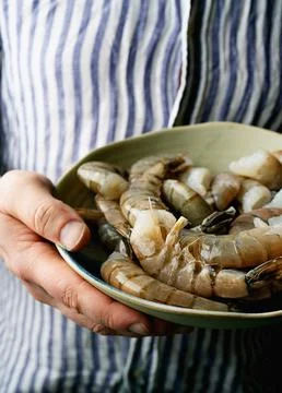 Raw shrimps on the dark rustic background Stock Photos