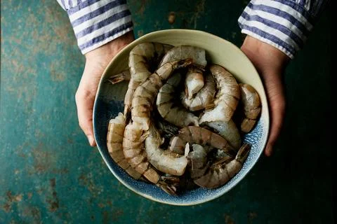 Raw shrimps on the dark rustic background Stock Photos