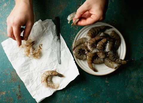Raw shrimps on the dark rustic background Stock Photos