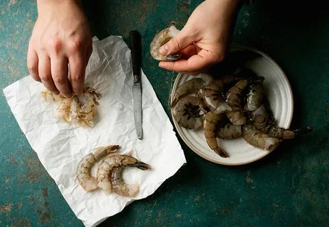 Raw shrimps on the dark rustic background Stock Photos